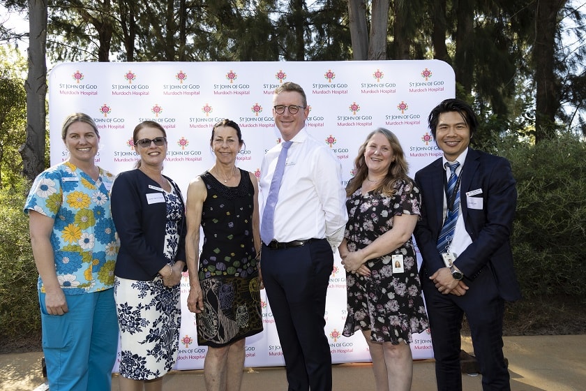 Hospice Nurse Unit Manager Jessica Wirrell, Director of Nursing Sarah-Jayne Powell, City of Melville Mayor Katy Mair, St John of God Murdoch Hospital Chief Executive Officer Ben Irish, Clinical Lead Palliative Care WA Health Associate Professor Alison Parr, Director of Hospice and Palliative Care Dr Scott Lee smiling at the camera.