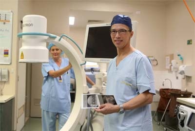 Mr Phil Gan with the new mobile X-ray machine