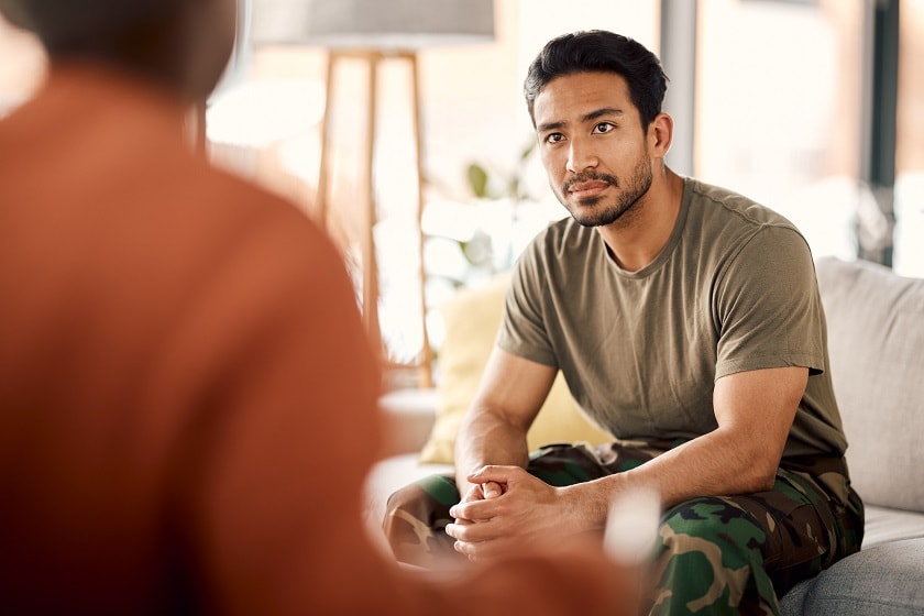 stock image of man talking to another person